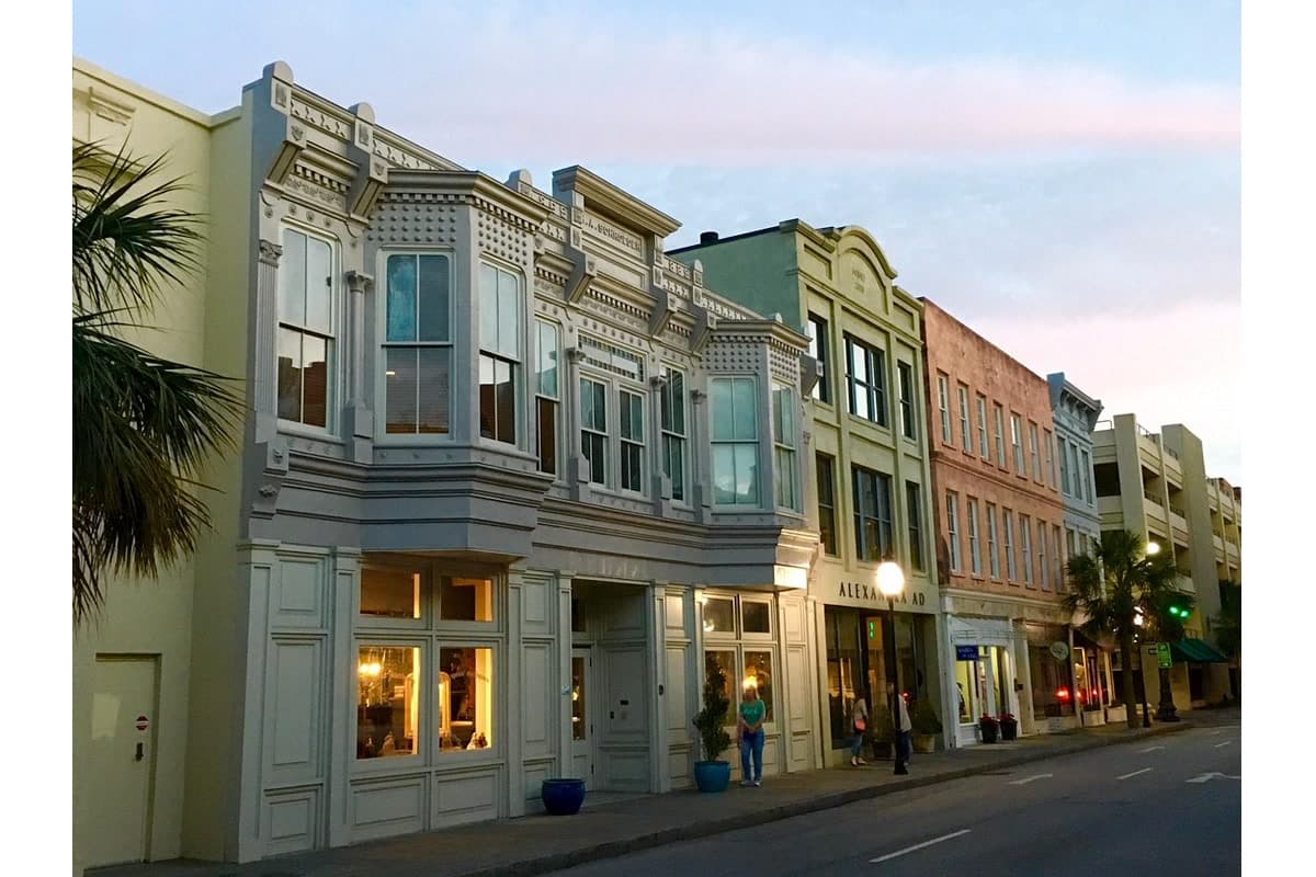 King Street in Charleston at sunset with historic storefronts and warm evening light